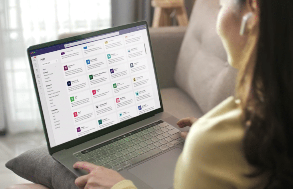 Picture shows a user accessing apps in Microsoft Teams.