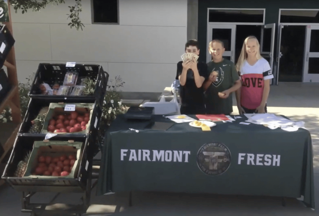 Photo of students selling their garden produce