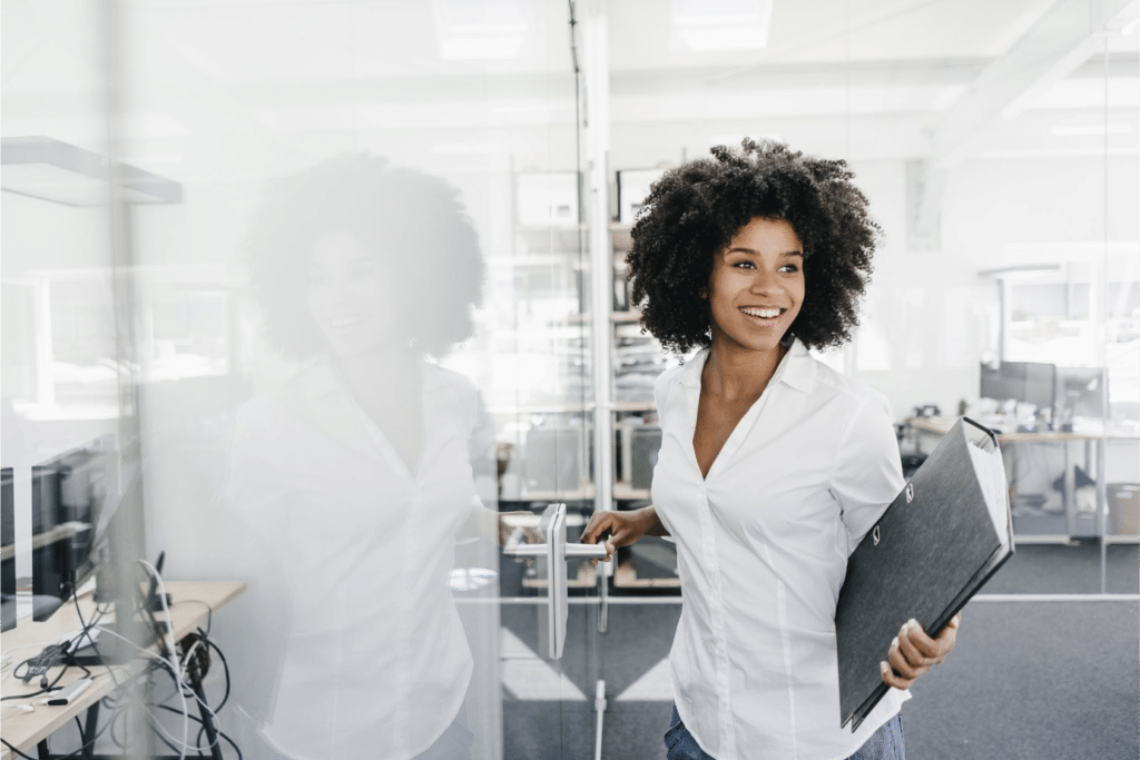 Image of a happy employee who feels recognized by her boss.