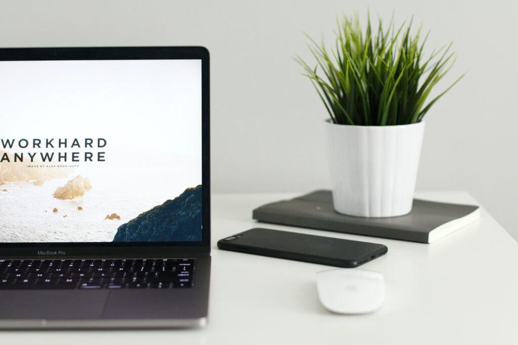 Picture of a laptop with a screen that reads, "Work hard anywhere."