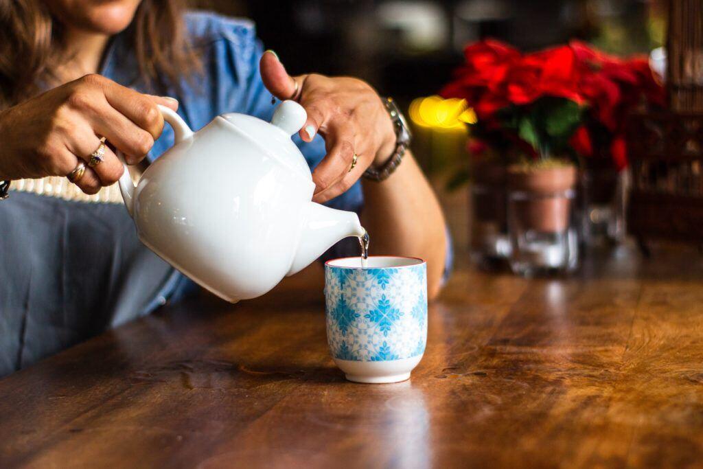 Picture shows an employee taking a break to drink some tea.