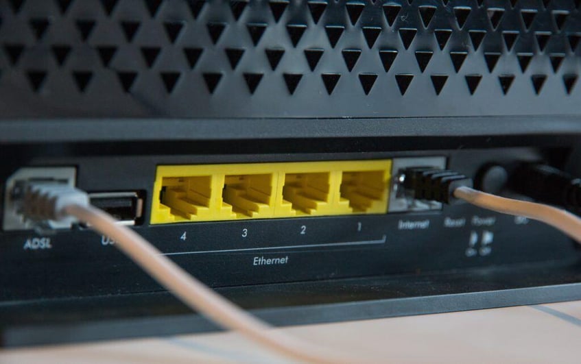This image depicts a router with cords. 