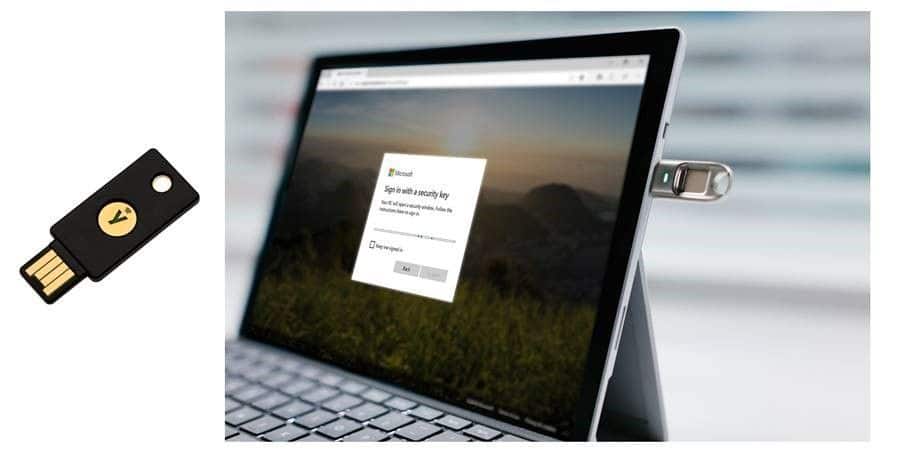 Photo of a FIDO 2 key and a device running Windows 10 for passwordless authentication with Microsoft 365.
