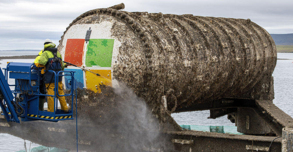 Image of Microsoft's Project Natick, a submersible datacenter, being cleaned off after two years of being submerged in the ocean.