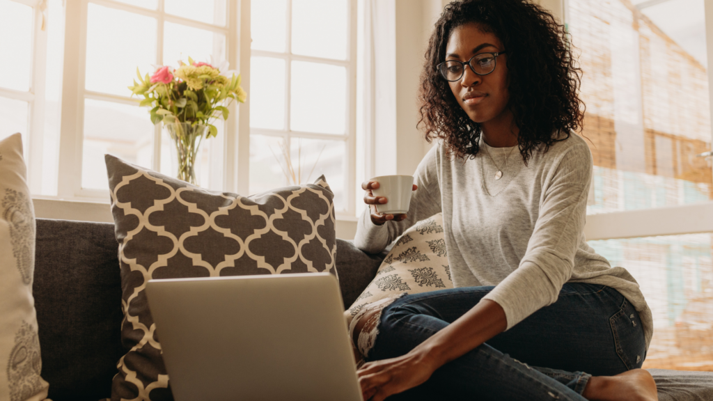 A woman is on her computer trying to fix her internet connection. 