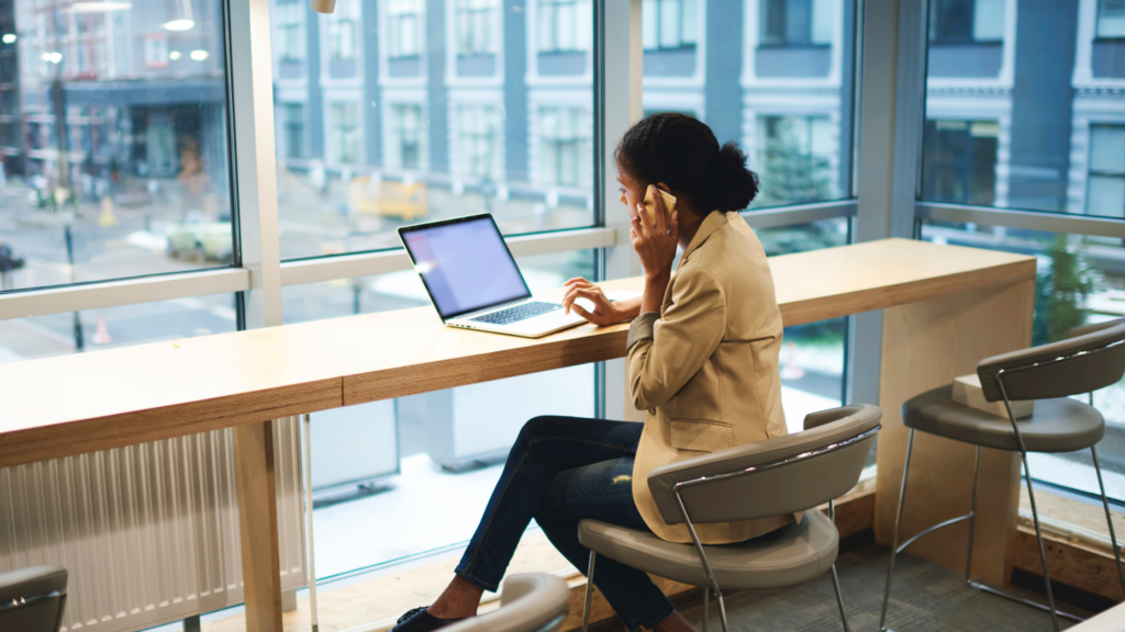 Woman on the phone, calling her internet provider. 