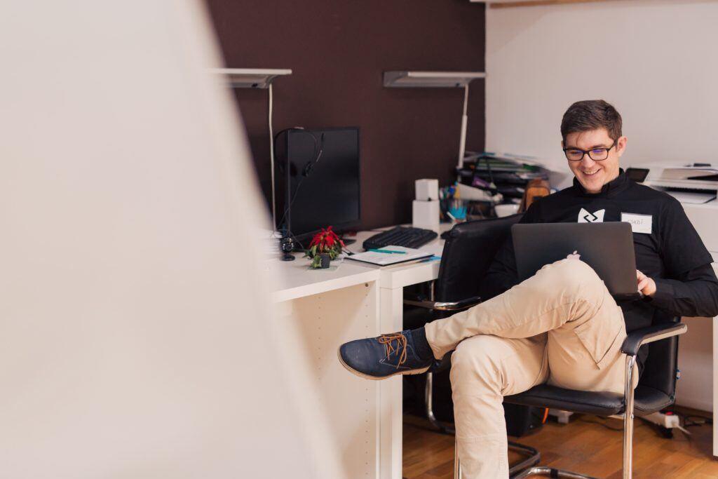 An employee smiles with ease knowing he has a strong password he doesn't have to remember.