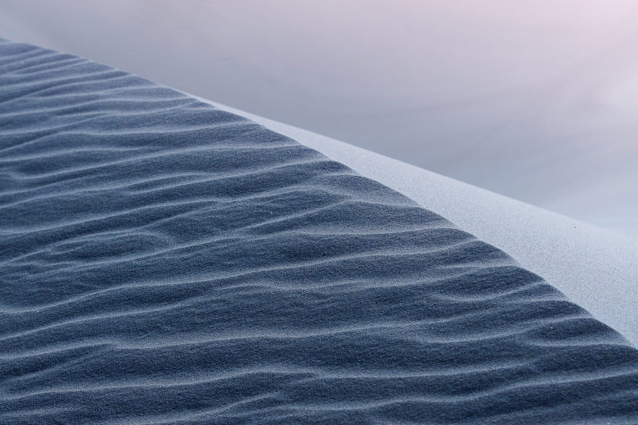 Image of sand patterns demonstrates emergence, a phenomena of quantum materials.