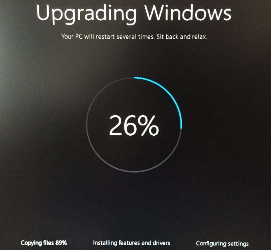 Image shows Windows upgrade in progress.